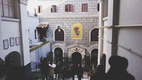 People in front of building