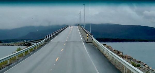 High angle view of suspension bridge over sea against sky