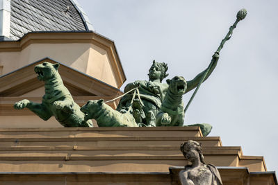 Low angle view of statue against sky