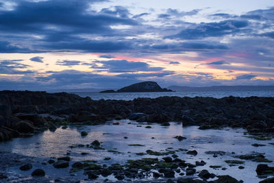 Scenic view of sea against sky during sunset