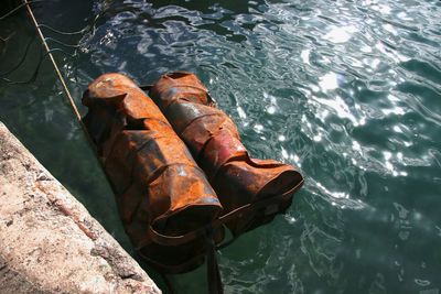 High angle view of rusty metal by sea