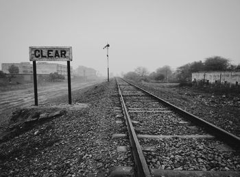 Railroad tracks against clear sky