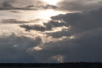 Low angle view of silhouette land against sky