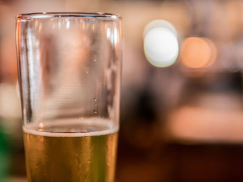 Close-up of beer glass on table