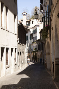 Narrow alley amidst buildings in town