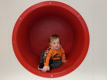 High angle view of boy standing in mirror