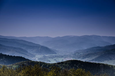 Scenic view of mountains against sky at night