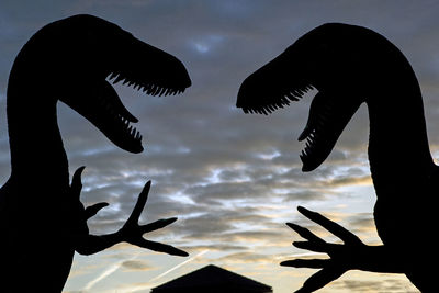 Low angle view of silhouette bird against sky