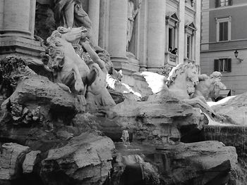 Low angle view of statue in front of building