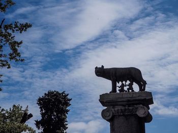 Low angle view of statue against sky