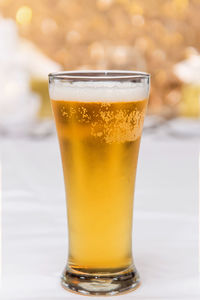 Close-up of beer glass on table