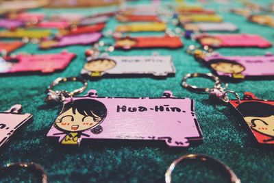 High angle view of key chains with text on table