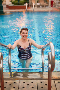 Portrait of smiling boy in swimming pool