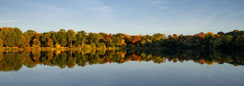 Scenic view of lake against sky during autumn