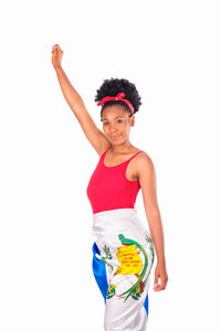 Portrait of smiling young woman against white background