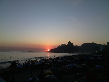 Scenic view of sea against clear sky during sunset