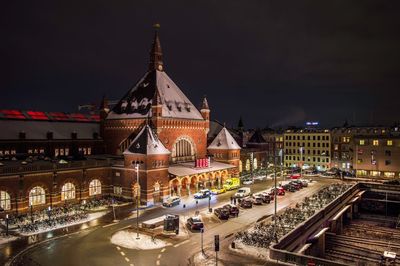 Illuminated city street at night