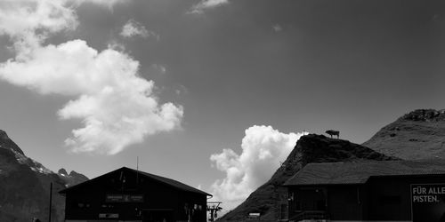 Low angle view of houses and buildings against sky