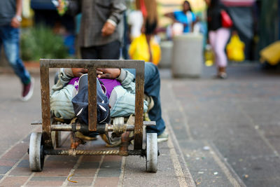 Man resting on cart