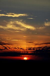 Scenic view of sea against romantic sky at sunset