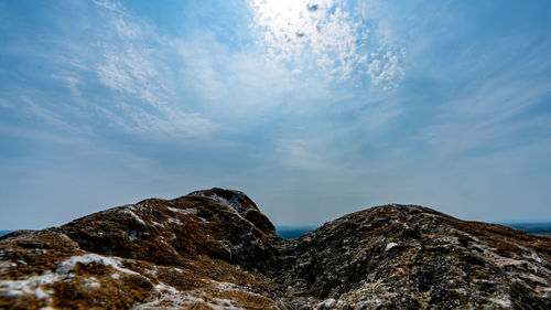 Low angle view of rock formation against sky