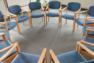 High angle view of chairs on table