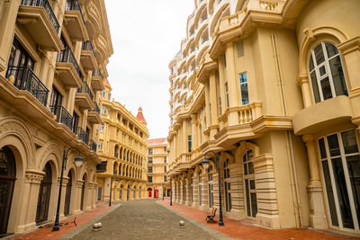 Low angle view of buildings against sky in city