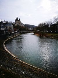River amidst trees against sky