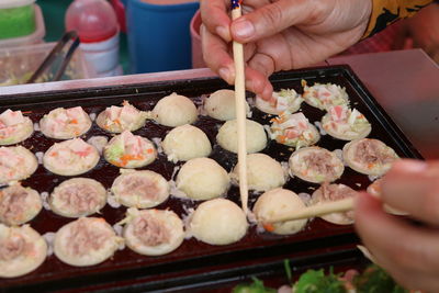 Midsection of man preparing food