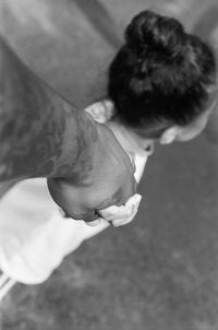 High angle view of man holding hands