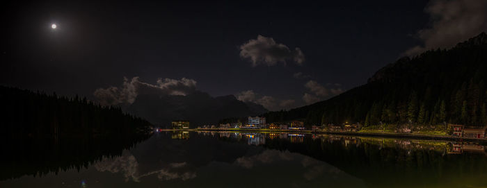 Panoramic view of lake and mountains against sky at night