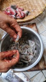 Close-up of hand holding fish for sale
