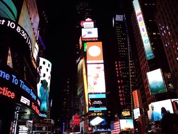 Low angle view of illuminated city at night