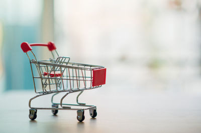 Close-up of empty chairs on table at store