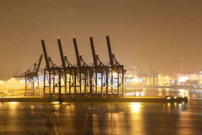 Commercial dock by sea against sky