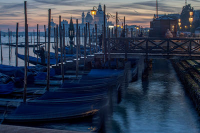 Boats moored at harbor