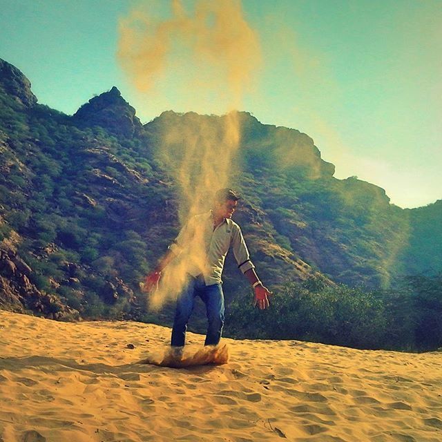 leisure activity, lifestyles, sky, full length, mountain, men, vacations, scenics, tranquil scene, sunlight, landscape, beauty in nature, sand, nature, sunset, person, heat - temperature, tranquility