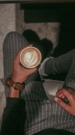 Woman holding coffee cup