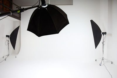 Low angle view of umbrella against white background