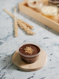 High angle view of chocolate dessert cup on table