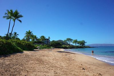 Scenic view of beach against clear sky