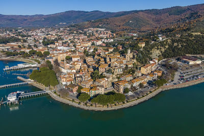 Aerial view of passignano sul trasimeno, a small town along the lake near perugia,