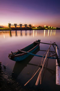 Boats moored in lake against sky during sunset at batujai lake 