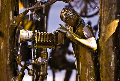 Close-up of statue on metal