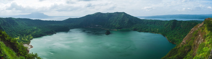 Panoramic view of river amidst trees against sky