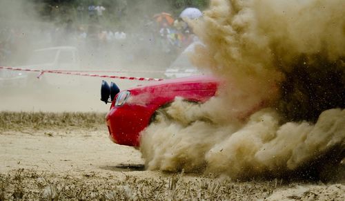 Smoke coming out of car during race