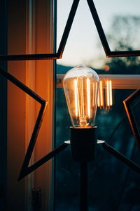 Close-up of illuminated light bulb