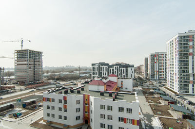 High angle view of buildings in city against sky