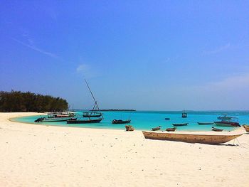 Boats moored in sea