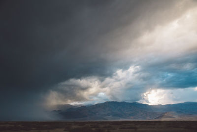 View of landscape against cloudy sky